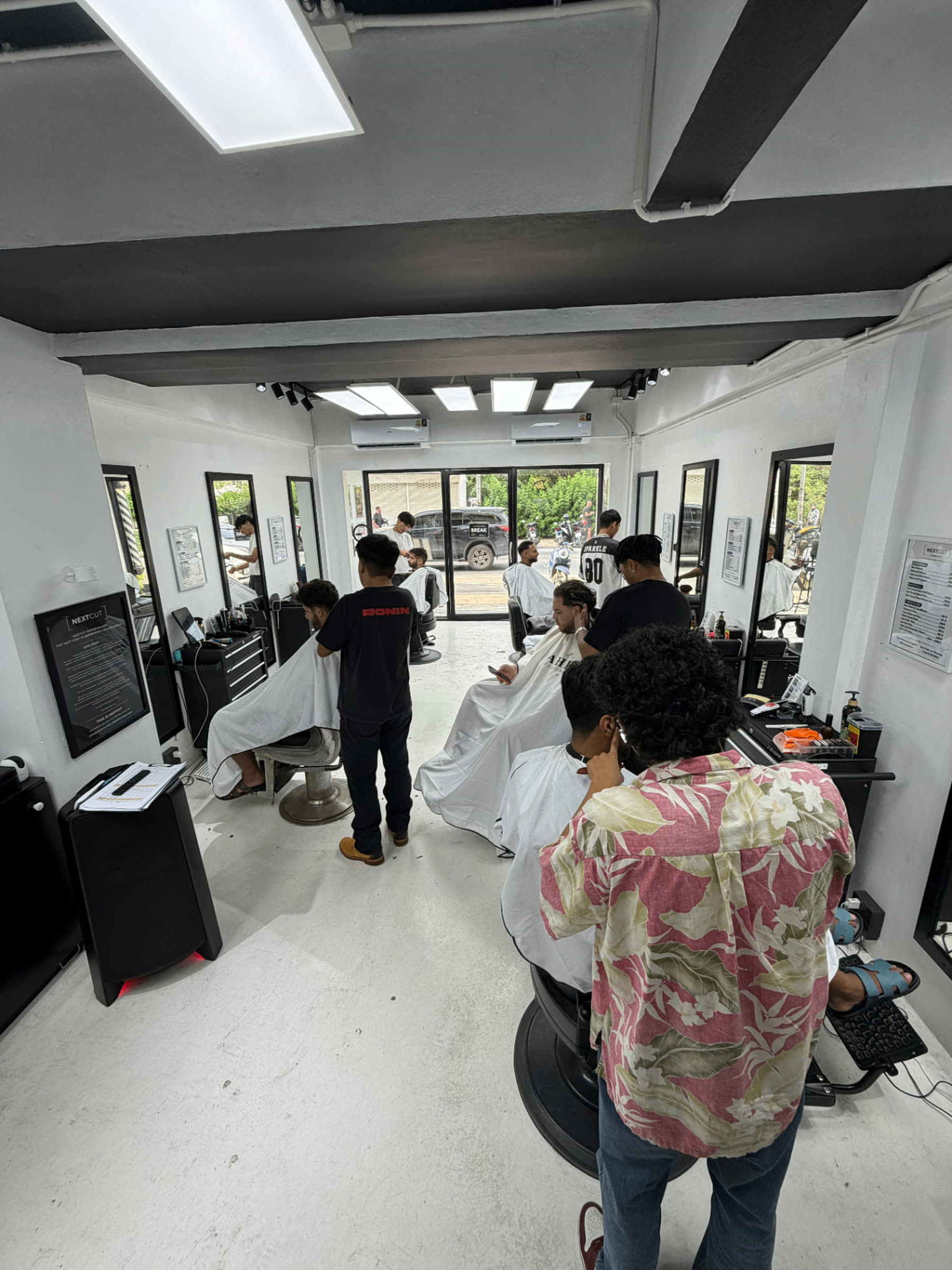 Interior of NextCut Barbershop with barber chairs ready for guests
